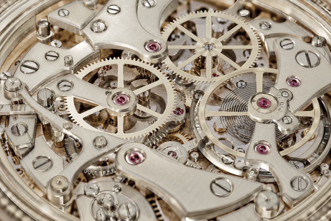 Champagne-gold watch movement: gears turn beneath stationary bridges as the page scrolls.